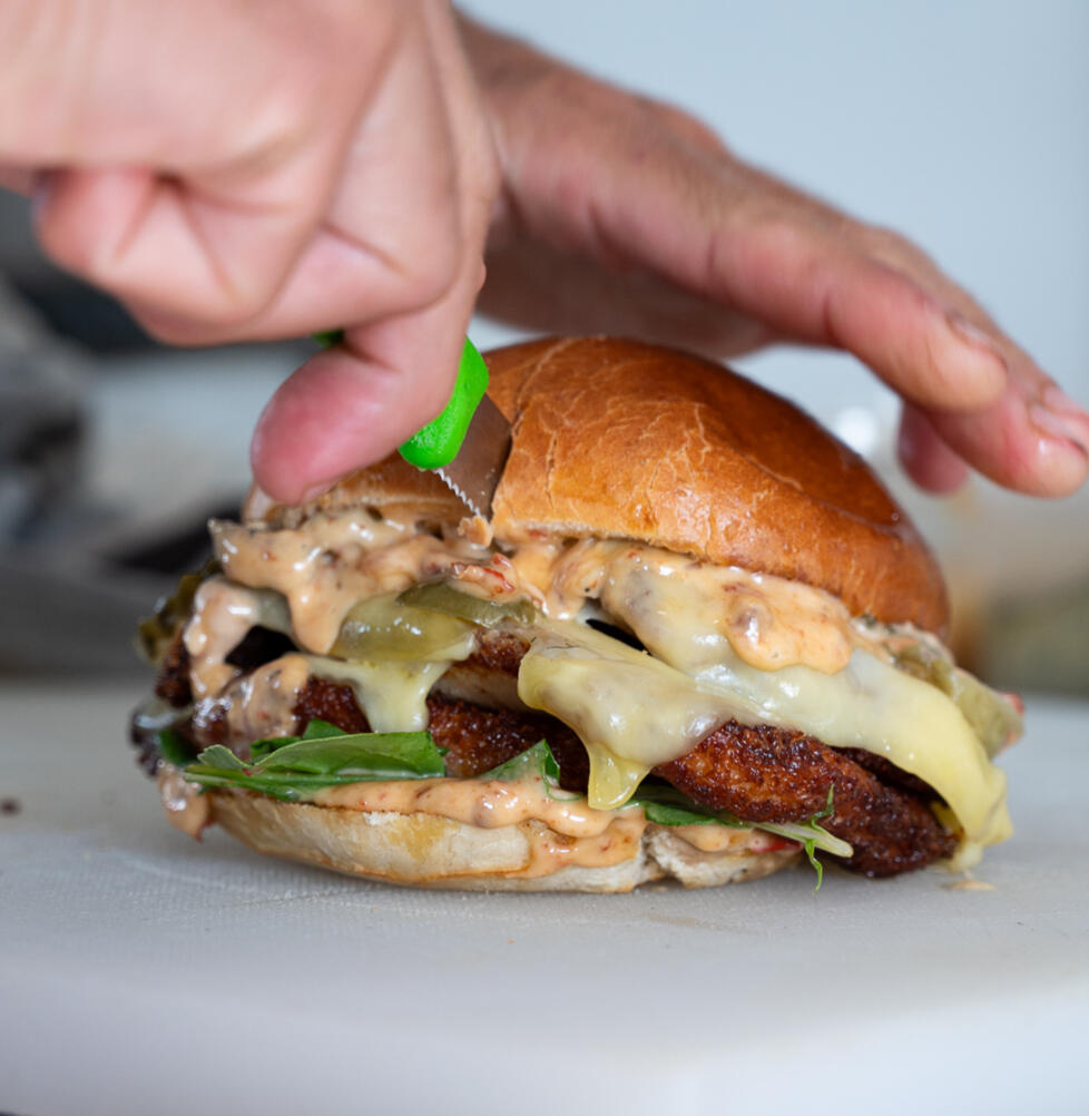 cutting a sandwich to share in wanaka